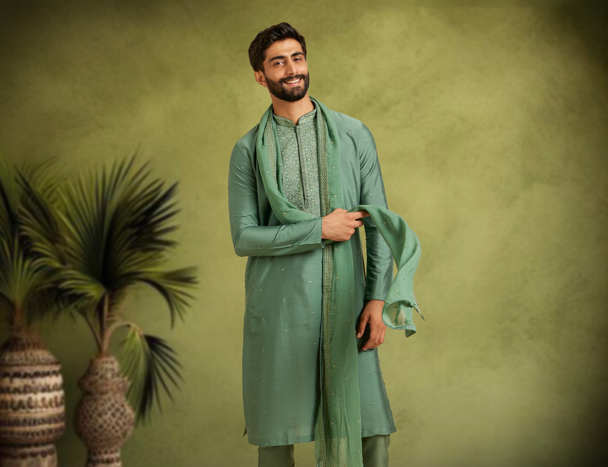 A man in elegant green kurta for wedding party
